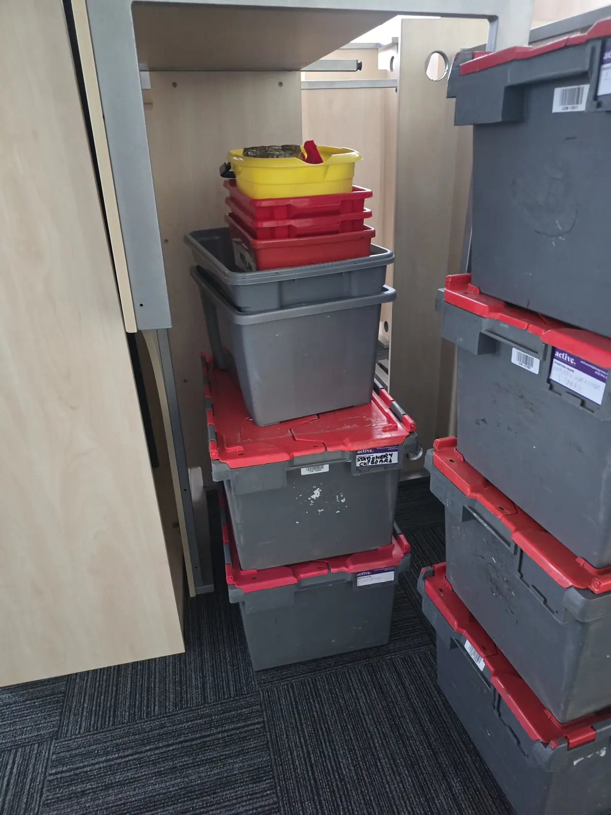 Crates stored inside office cupboards