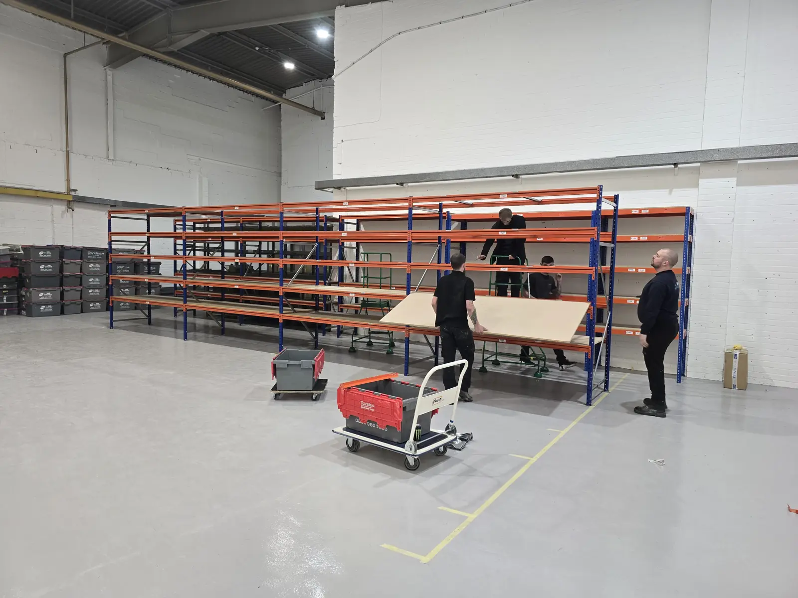 Crew building racking in the new unit