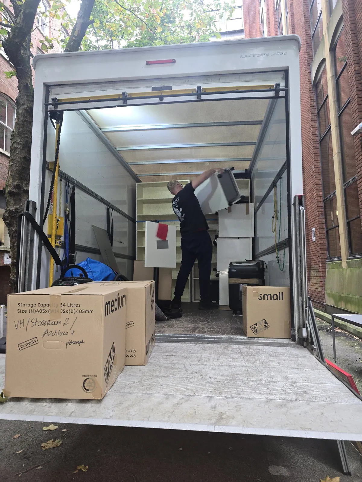 Our Luton van being loaded with packed boxes outside the school