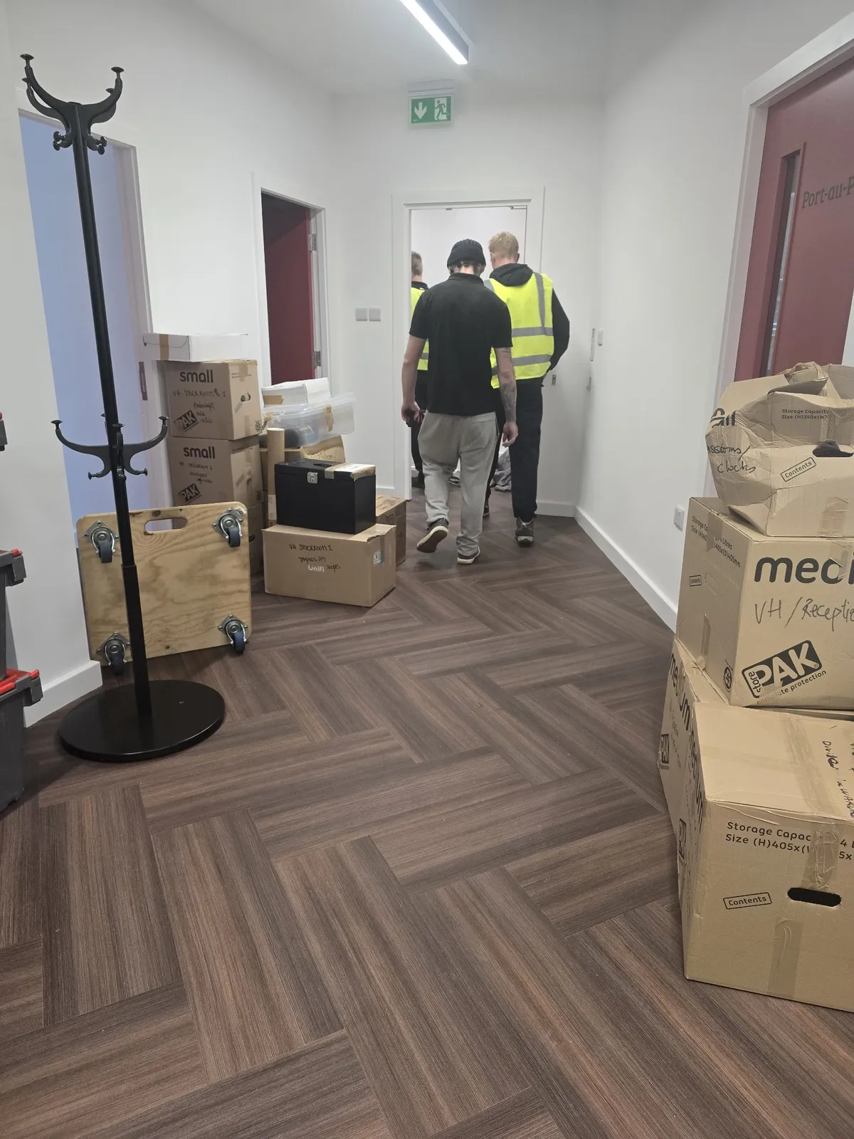 Packed boxes lined up along a clear corridor