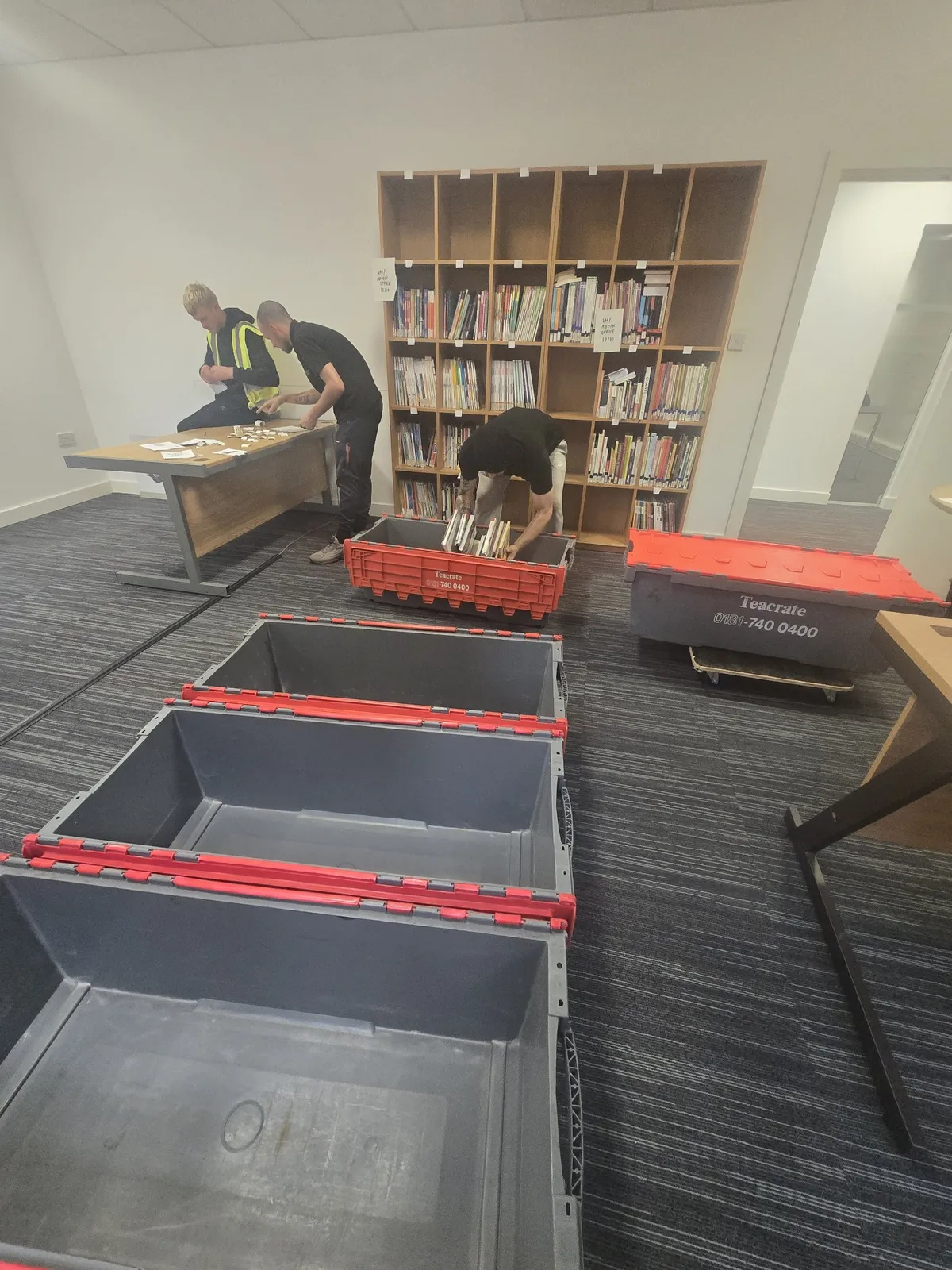 Our team packing the library into crates