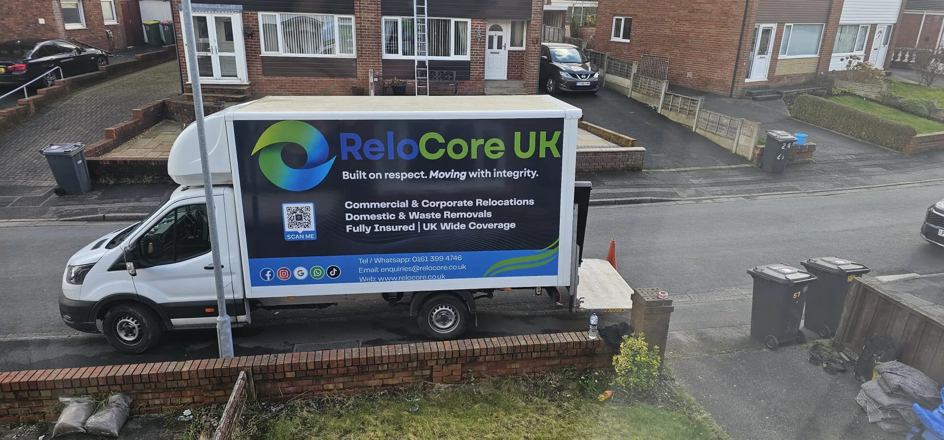 ReloCore UK Luton van parked on a residential street outside a customer's home
